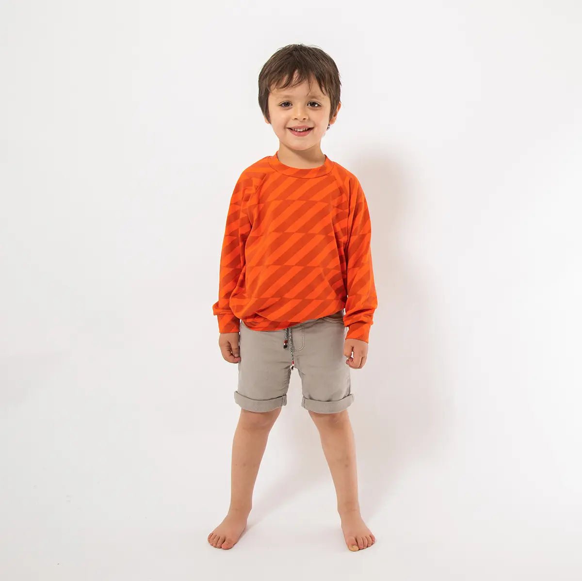 Orange Stripes Sweater from the baby and kids clothing collection at Pickle UK.